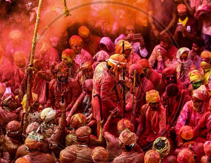 Barsana, Uttar Pradesh, India February 6 2021: People Of India Enjoying The Festival Of Holi By Throwing Colors Onto Each Other. Festive And Colors Concept.