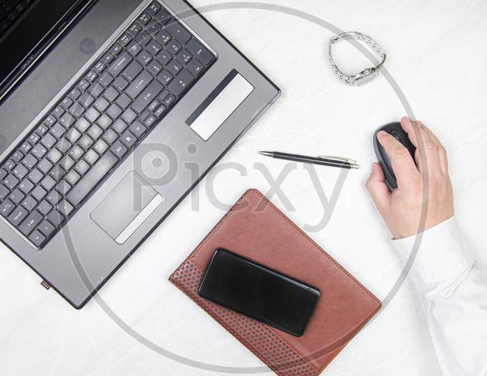 Businesman With Mobile Phone And Laptop