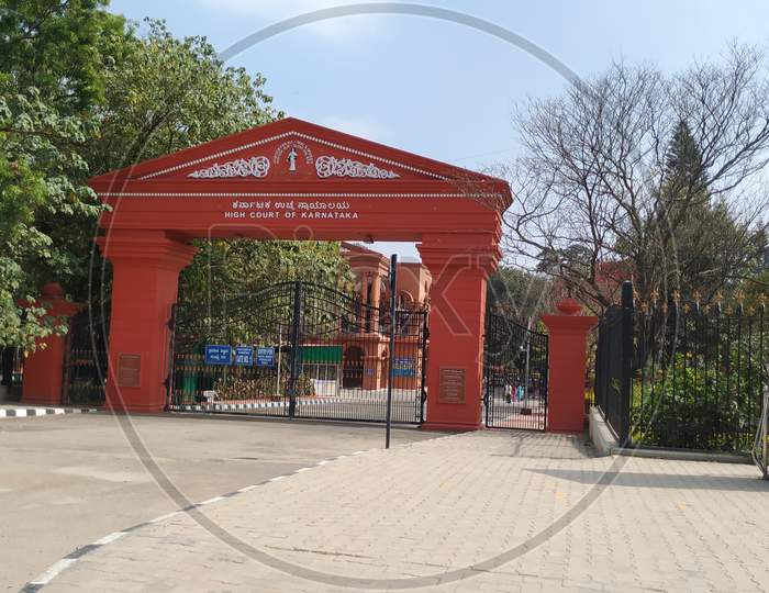 Closeup of beautiful Red color famous High Court of Karnataka Entrance Arch and Gate