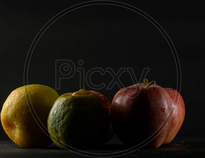 Fruits Arranged In Black Background