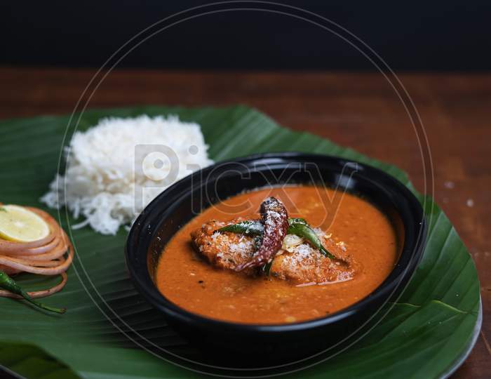 Indian Fish Curry With Rice Served On Banana Leaf,