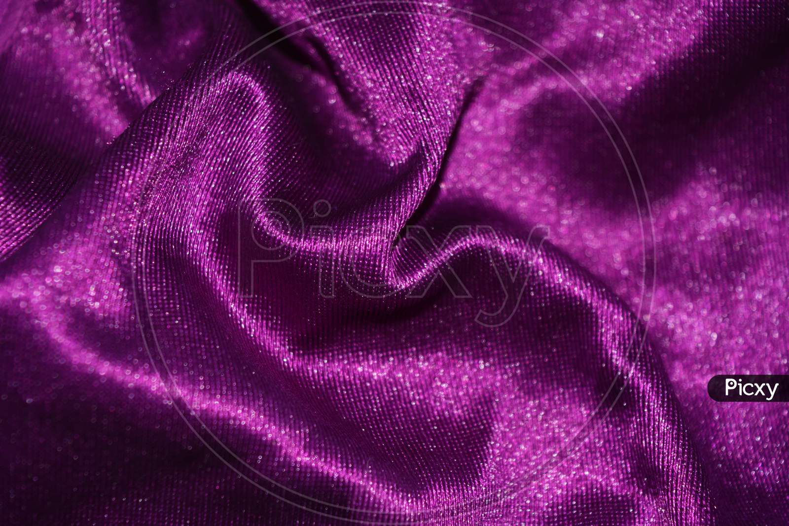 Purple velvet background containing velvet, fabric, and velour