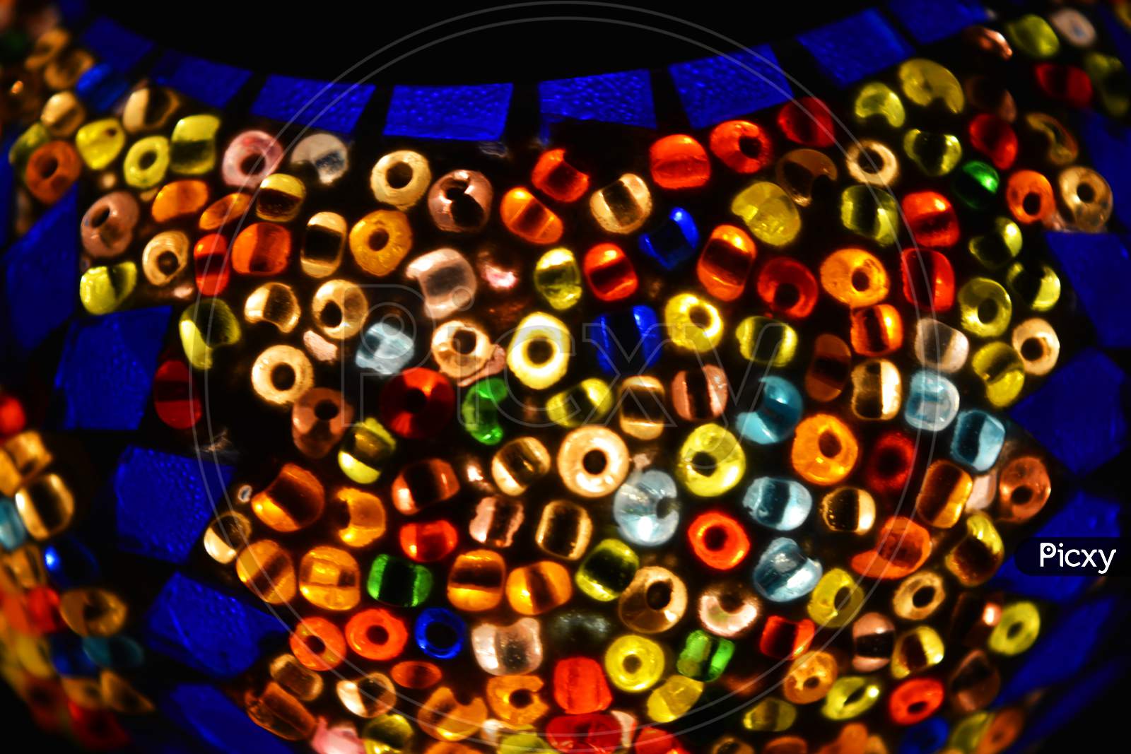 An unusual shade made of multicolored mosaics, colored beads and bright glass is located in the Turkish national lamp.