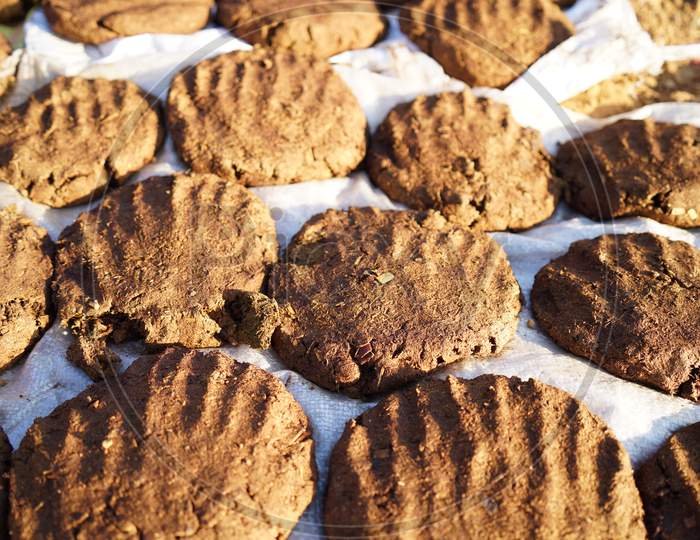 Dry Organic Cow Dung Cakes Ready To Use. Religious Cow Dung Cakes For Holi Festival In India.