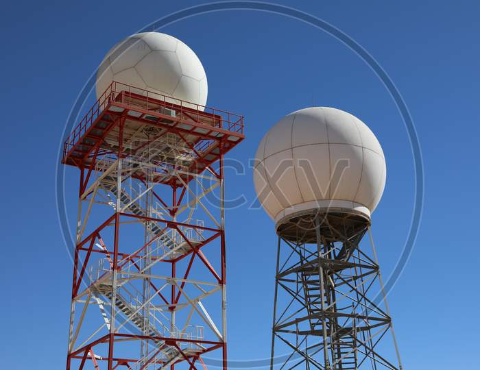 Weather Radar Towers Meteorological Station On Blue Sky