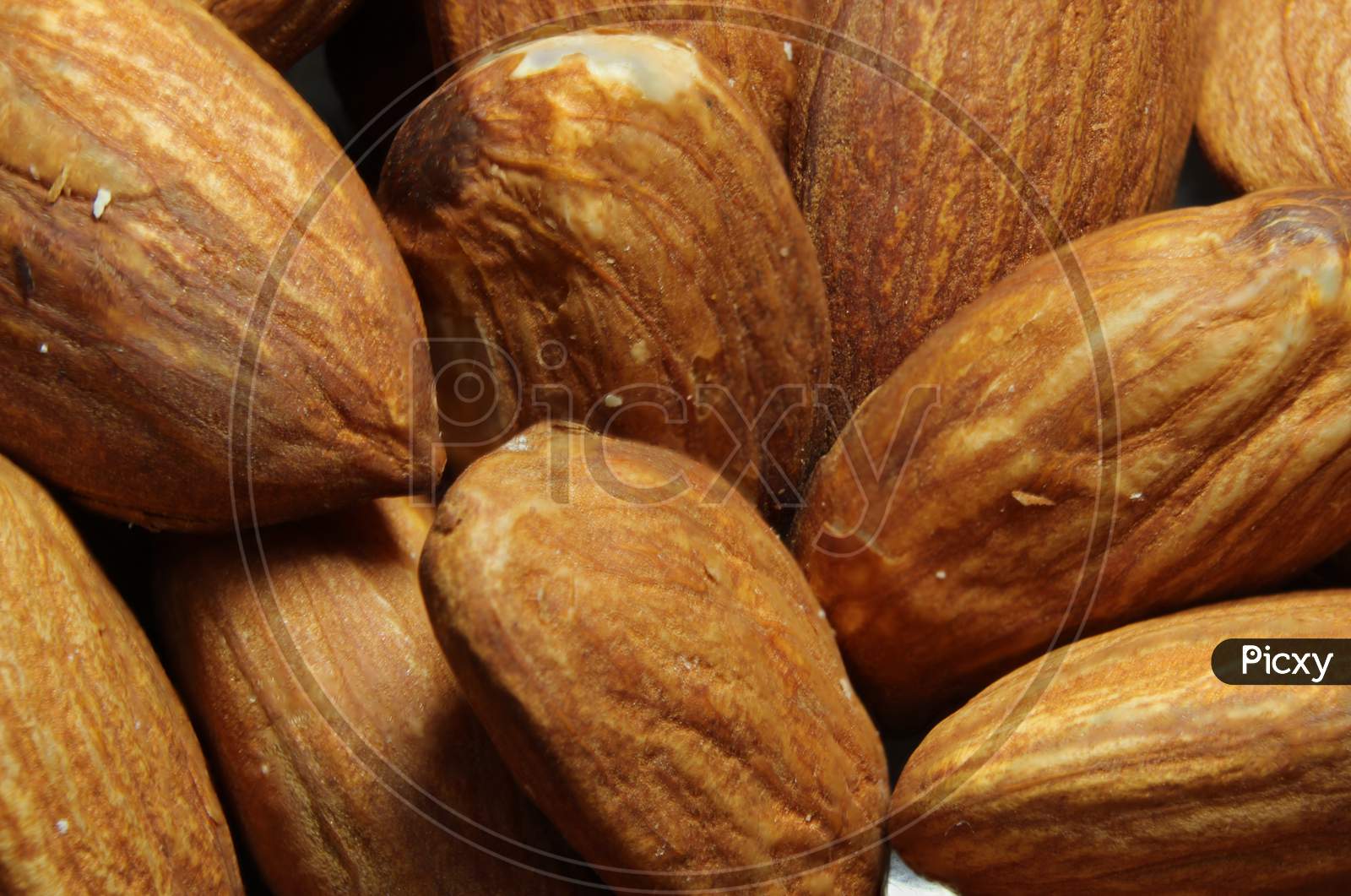Composition From Almond Nuts Background - Macro Photograph Of Almond Nuts