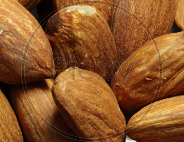 Composition From Almond Nuts Background - Macro Photograph Of Almond Nuts