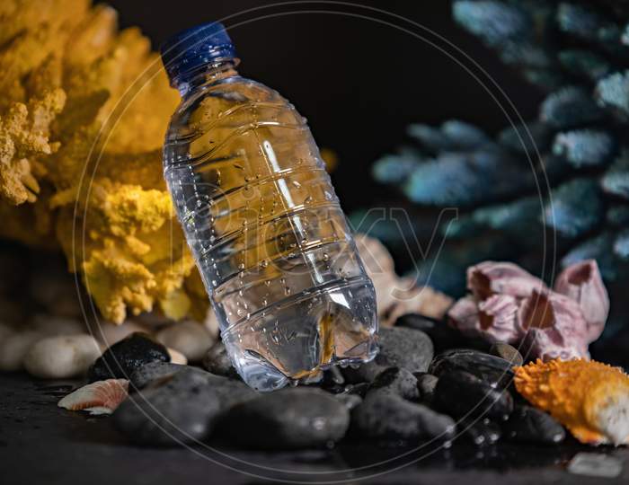A,Water,Bottle,On,Pebbles,Photography