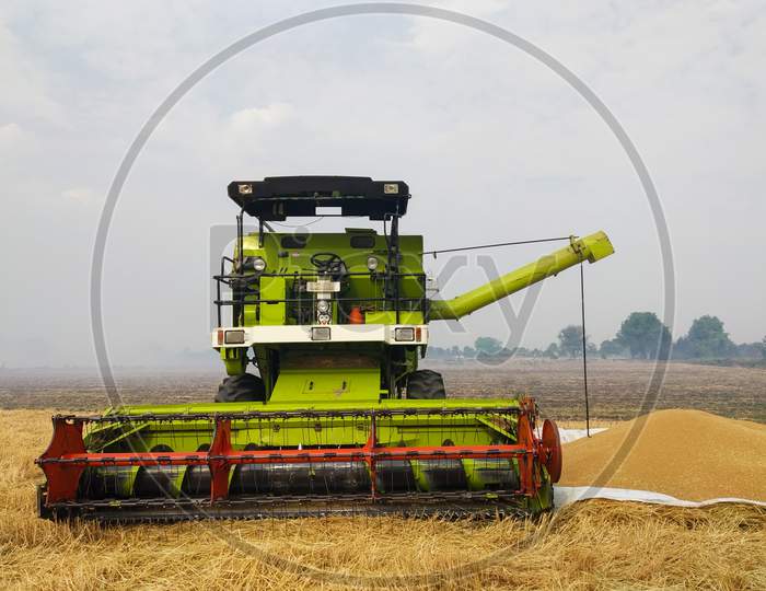 Combine Harvester On Wheat FieldIndian Farming Technology