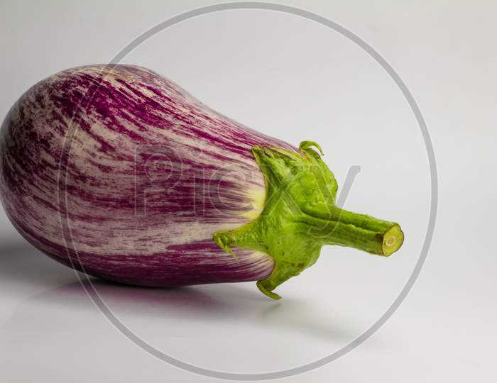 Ripe Purple And White Eggplant. Organic Food On White Background.