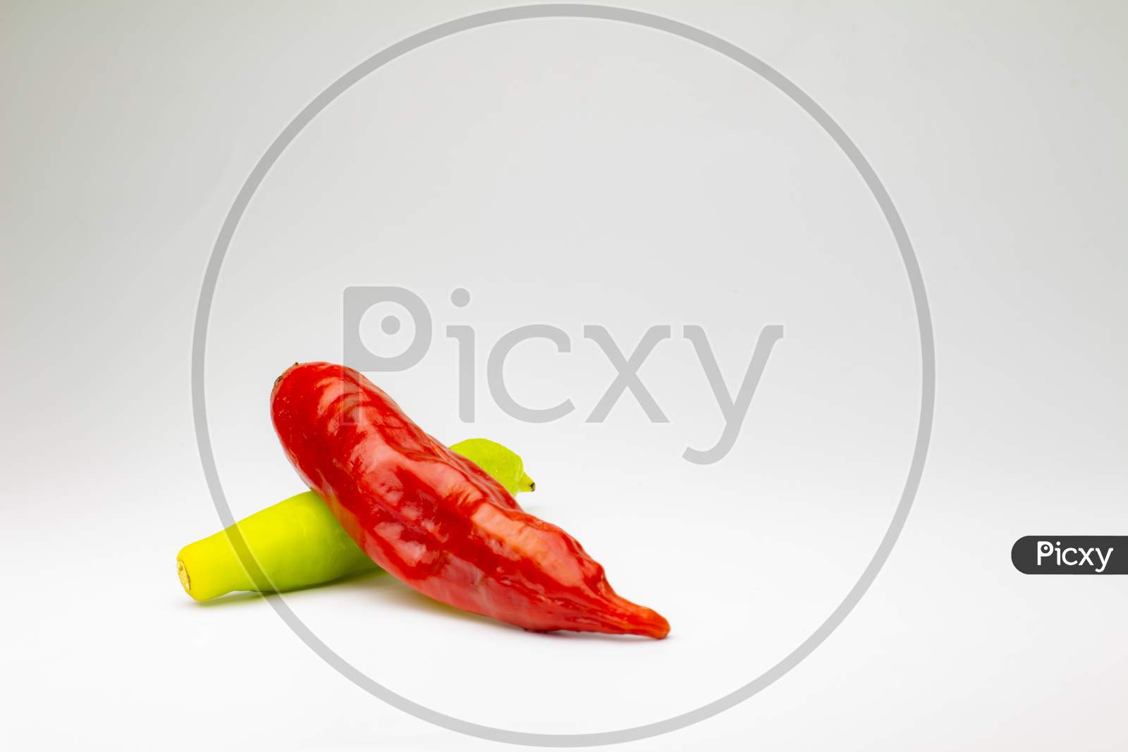 Small Red Chili Pepper On White Background. Free Space To Write. Spicy Food