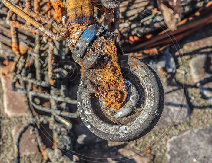 Rusty And Damaged Shopping Cart Found In The Port Of Kiel In Germany.