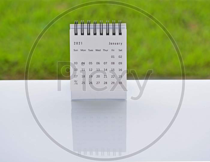 January 2021 White Calendar With Green Blurred Background - 2021 New Year Concept