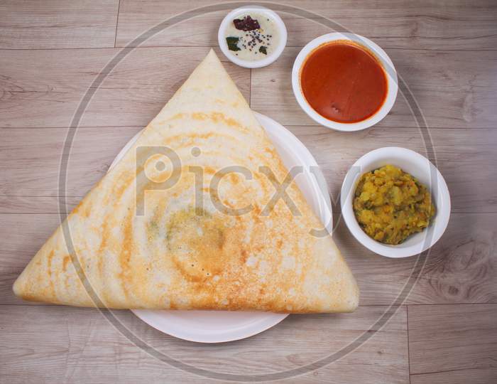 Masala Dosa Is A South Indian Dish That Is Served With Sambhar And Coconut Rubble. Selective Focus