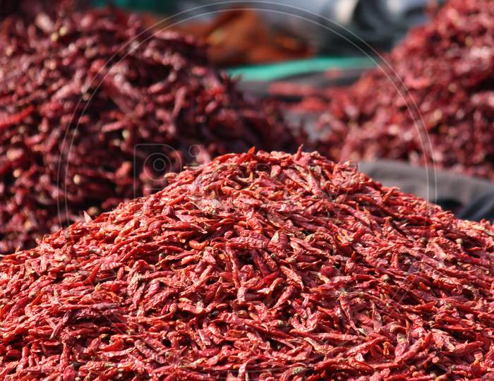 Heap Of Dried Red Chilly Kept Outside A Shop In A Spice Market.