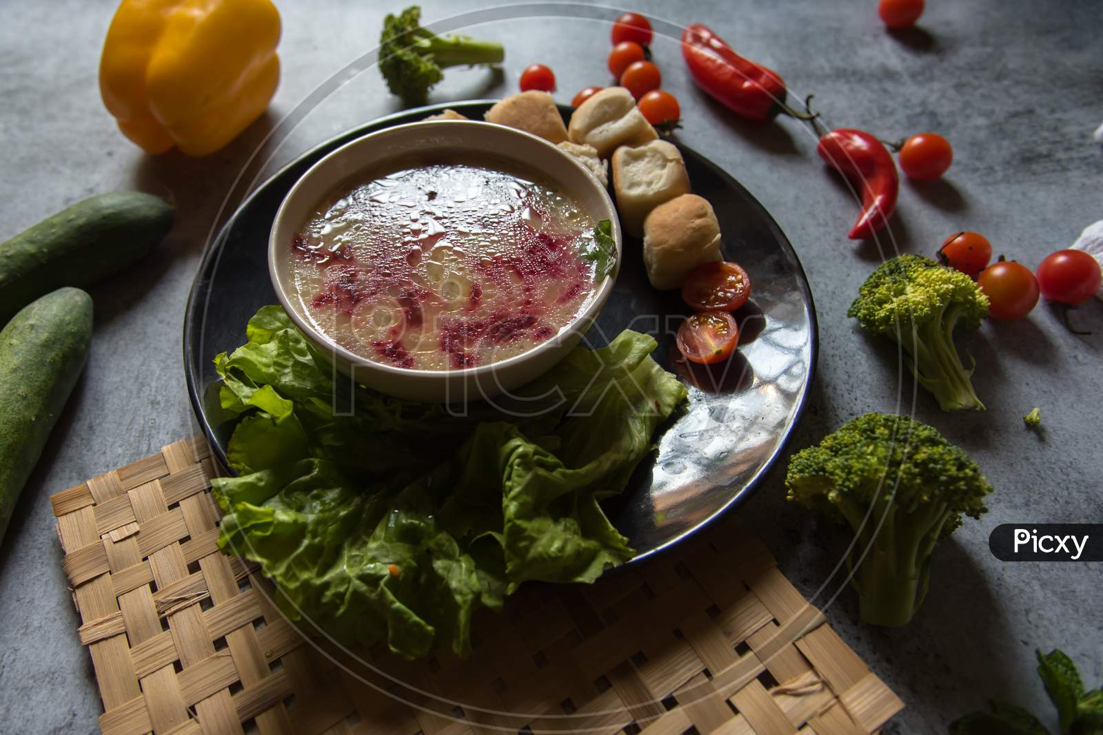 Healthy food ingredient chicken soup prepared with white oil and beetroot.