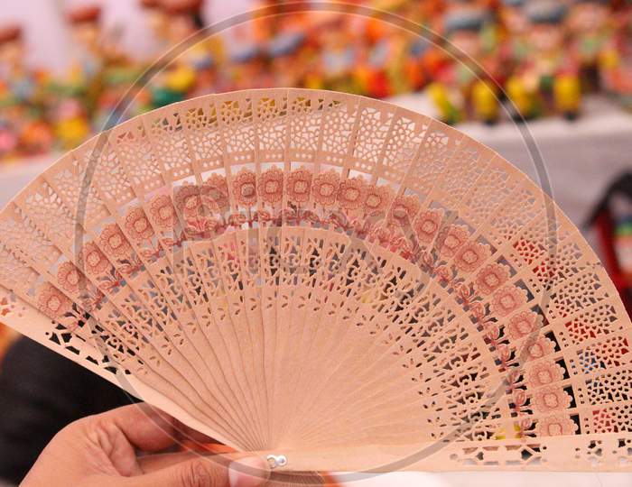Wooden Hand Fan Isolated On Light Background