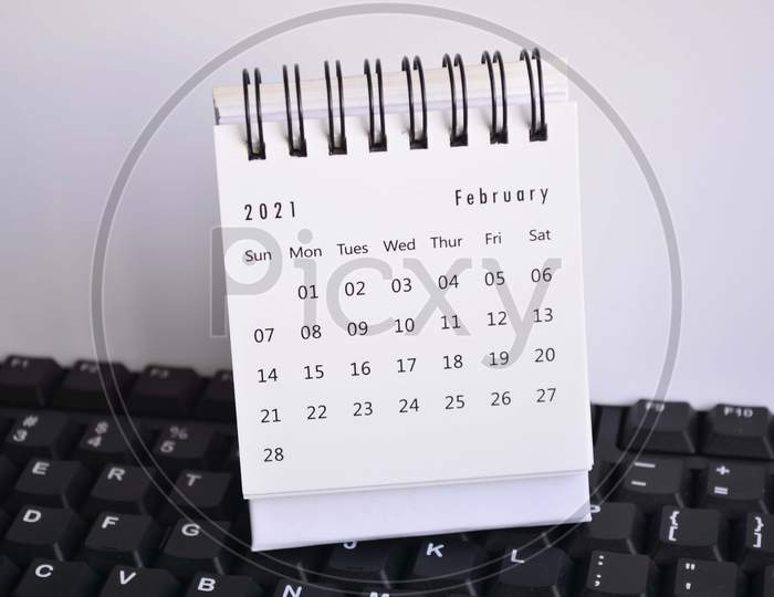 White February 2021 Calendar On A Keyboard With White Backgrounds. New Year Concept