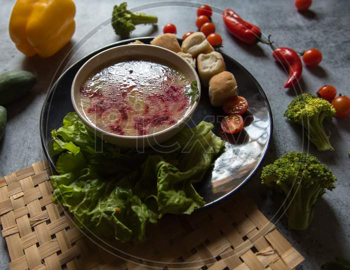 Healthy food ingredient chicken soup prepared with white oil and beetroot.