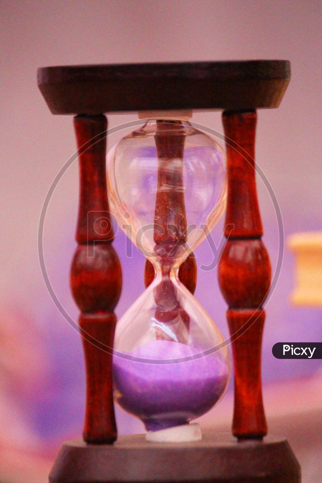 Hourglass On A Colorful Background