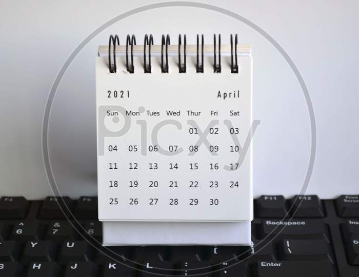 White April 2021 Calendar On A Keyboard With White Backgrounds