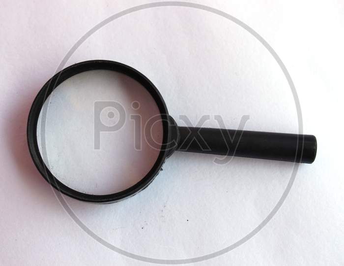 Close Up Single Magnifying Glass With Black Handle