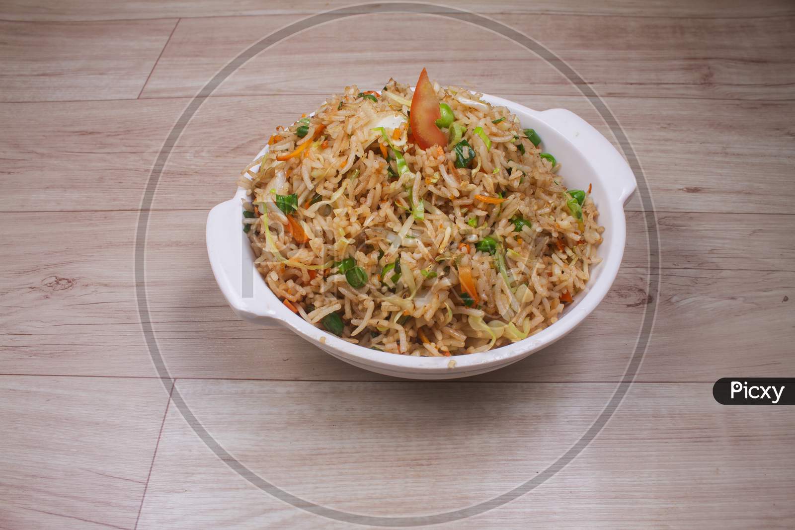 Healthy And Tasty Veg Fried Rice Made From Mixed Veggies, Served In Bowl On Rustic Wooden Background, Indian Cuisine, Selective Focus