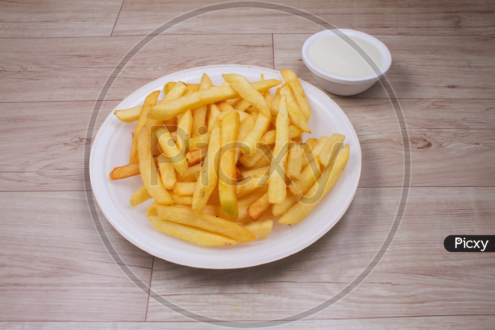 Portion Of French Fries With Sauce And Mayonnaise.Stock Photo