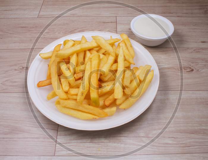 Portion Of French Fries With Sauce And Mayonnaise.Stock Photo
