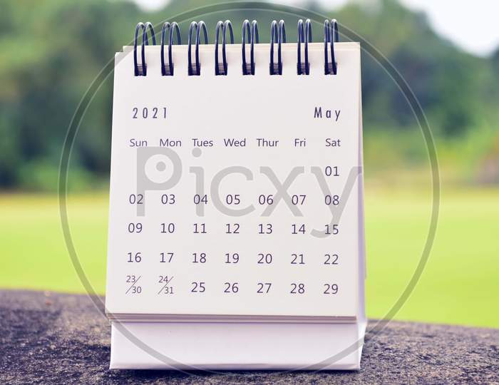 May 2021 White Calendar With Green Blurred Background. 2021 New Year Concept