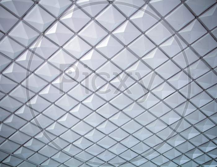 A Close-Up Of A Gray-White Ceiling