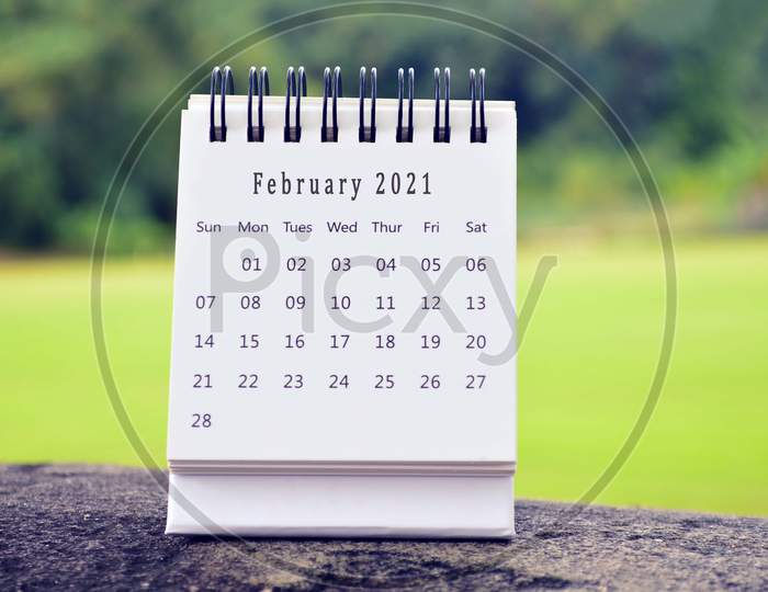 February 2021 White Calendar With Green Background. 2021 New Year Concept