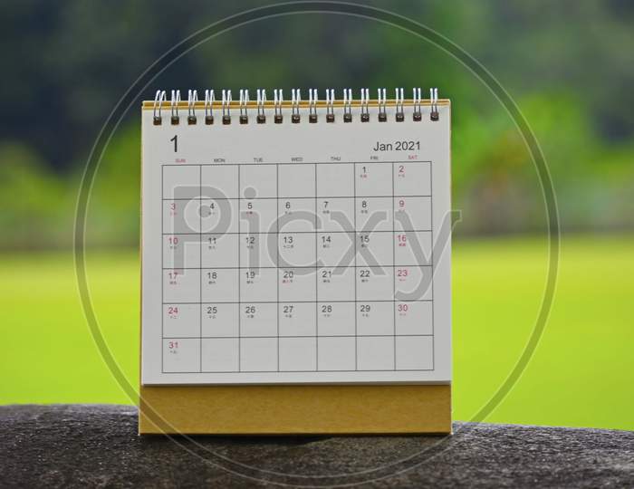June 2021 White Calendar With Green Blurred Background - New Year Concept