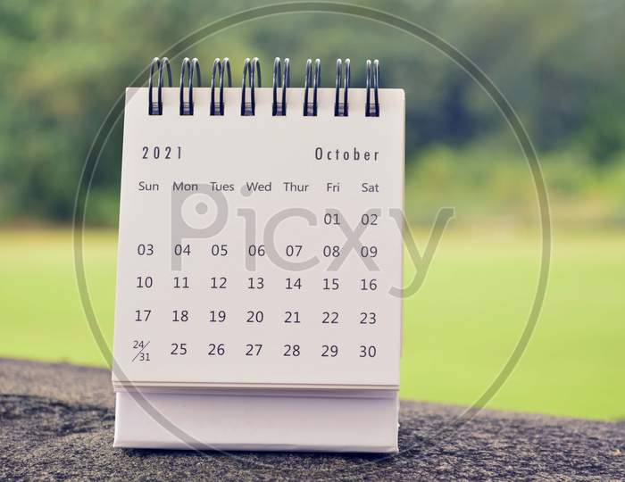 October 2021 White Calendar With Green Blurred Background
