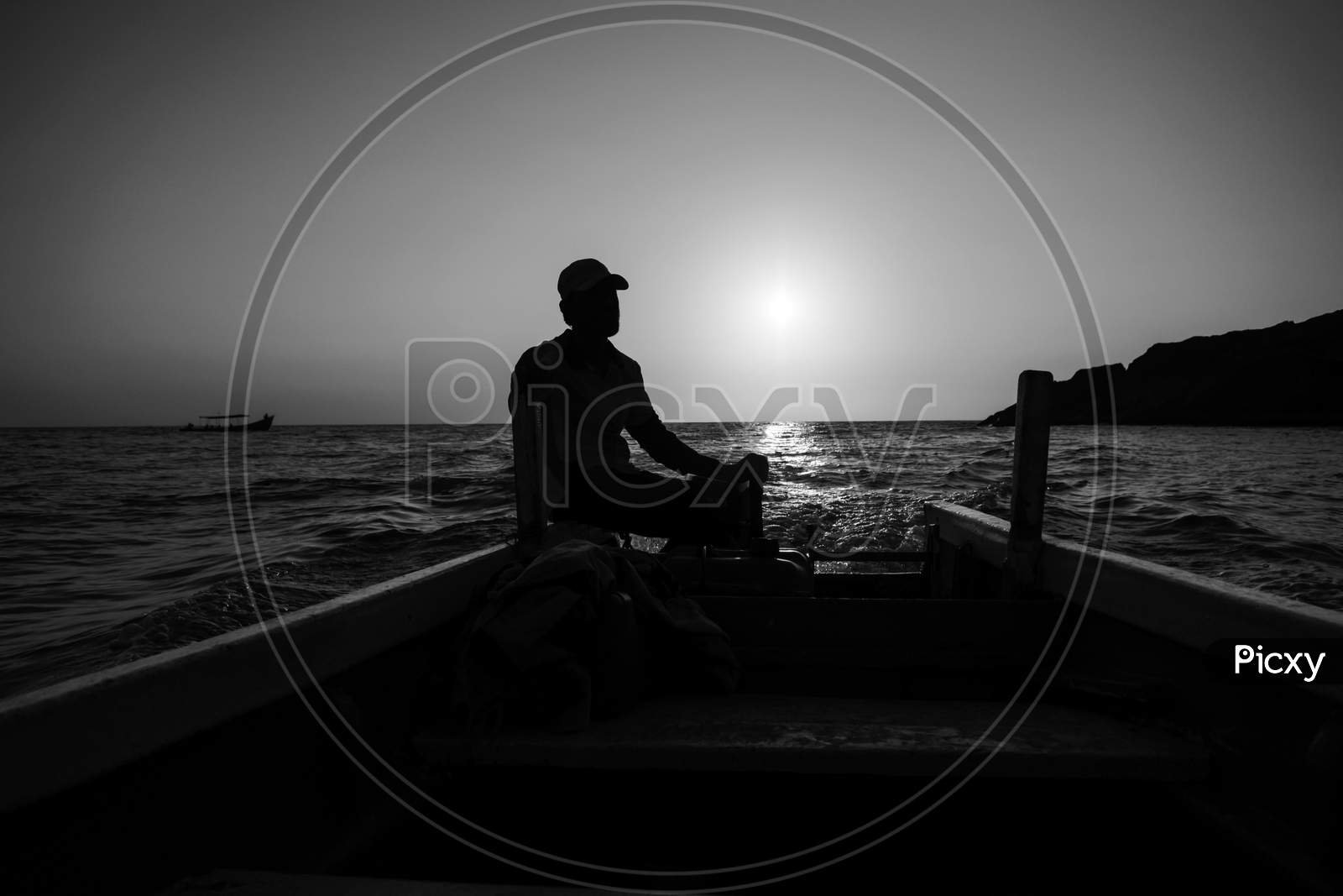 A Boat Man Near The Shore Of Om Beach