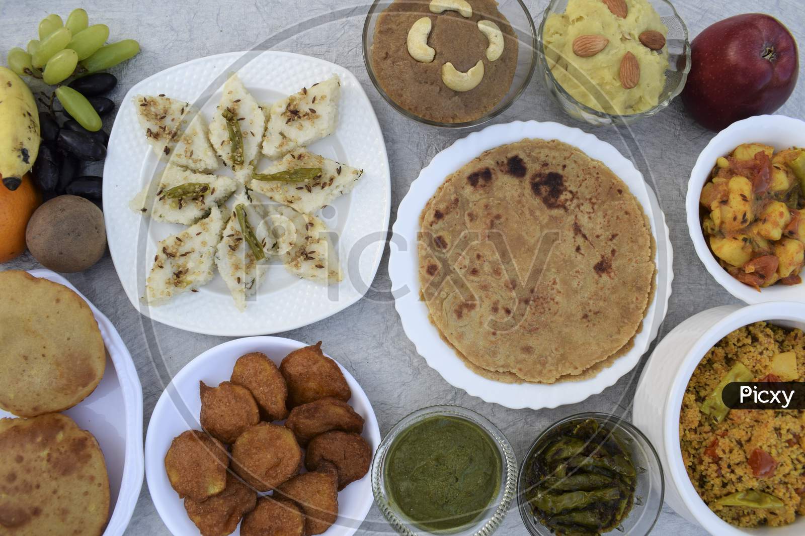 Indian Fasting Buffet Platter. Many Homemade Dishes Like Rajgira Sheera, Sweetpotato Halwa, Dhokla, Patatha, Chutney
