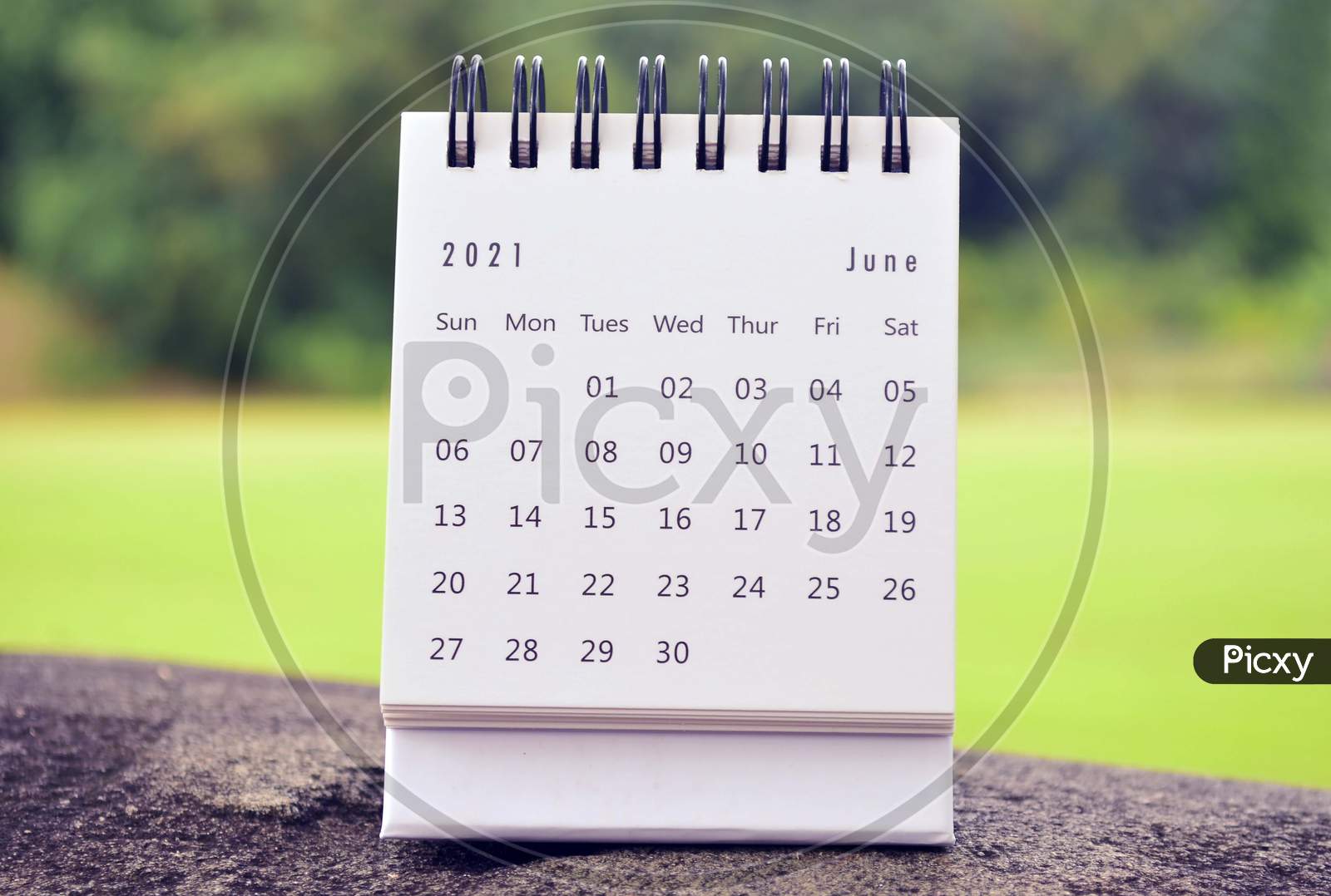 June 2021 White Calendar With Green Blurred Background. 2021 New Year Concept