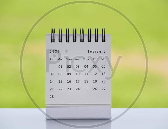 February 2021 White Calendar With Green Blurred Background - 2021 New Year Concept