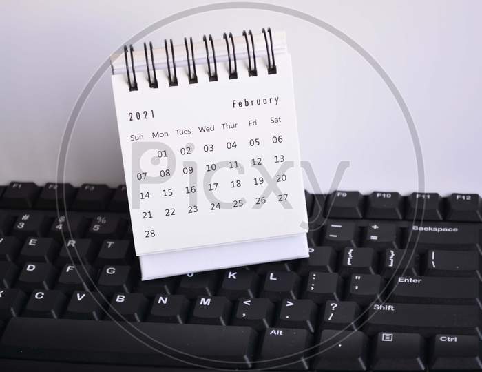 White February 2021 Calendar On A Keyboard With White Backgrounds. New Year Concept