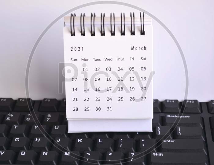 White March 2021 Calendar On A Keyboard With White Backgrounds