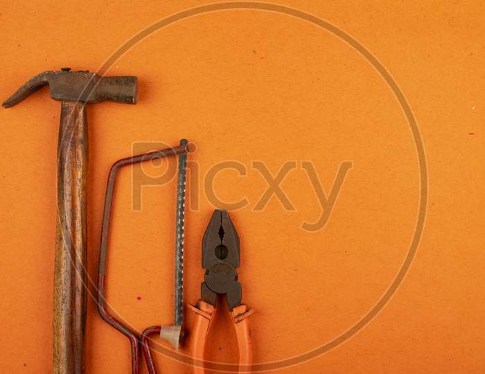 Tools On Orange Background With Space For Text, Happy Labour Day.