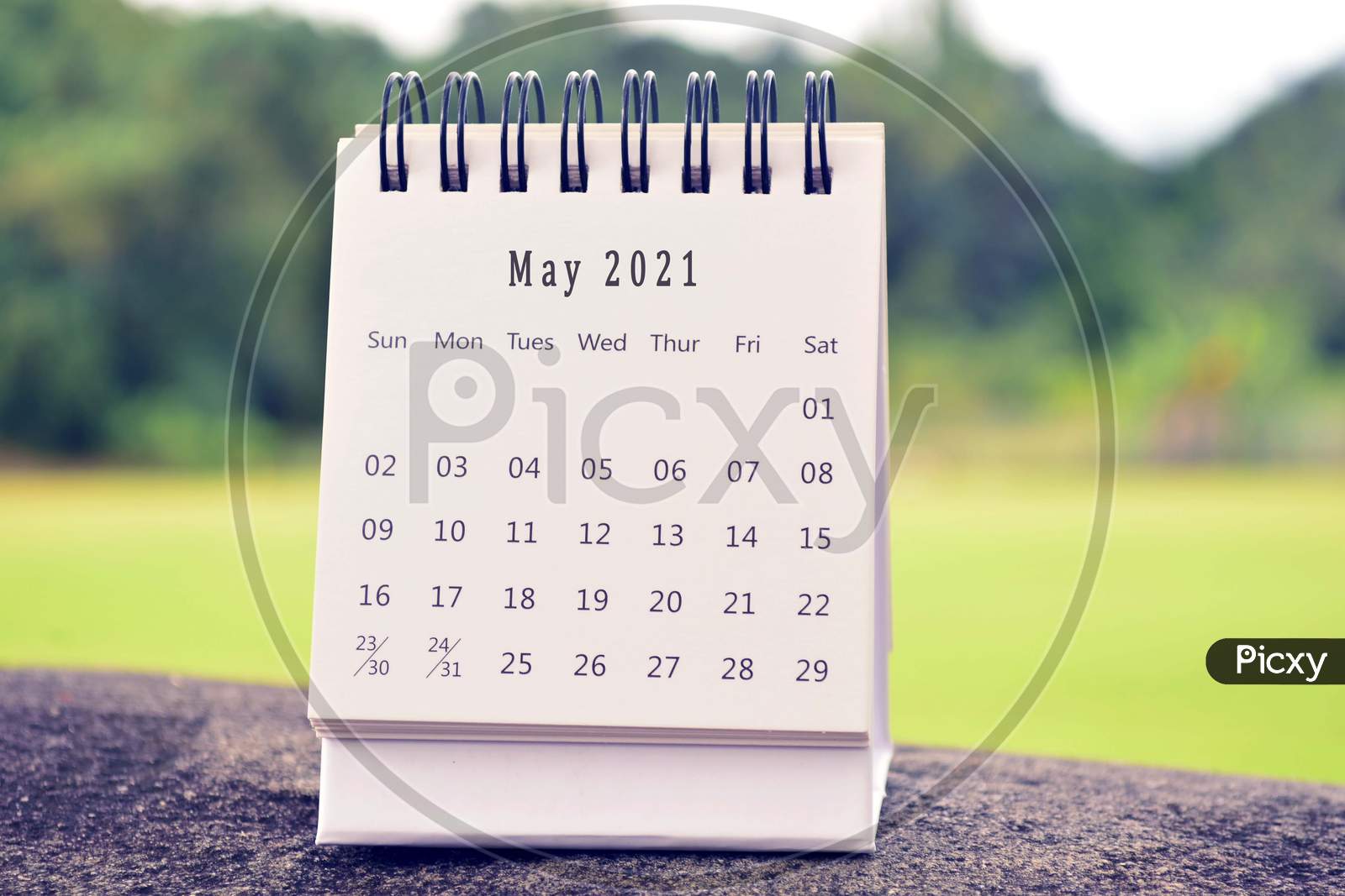 May 2021 White Calendar With Green Blurred Background. 2021 New Year Concept