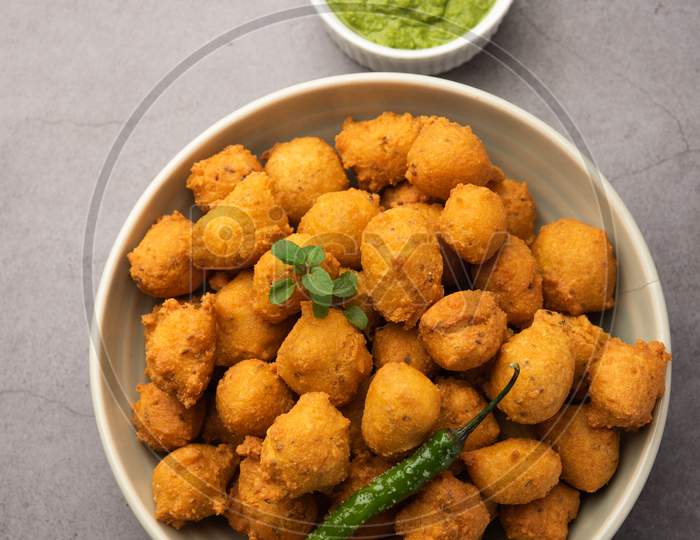 Indian Tasty Moong Dal Vada, Pakora, Bhajiya, Yellow Split Gram Fritters Served With Green Chutney