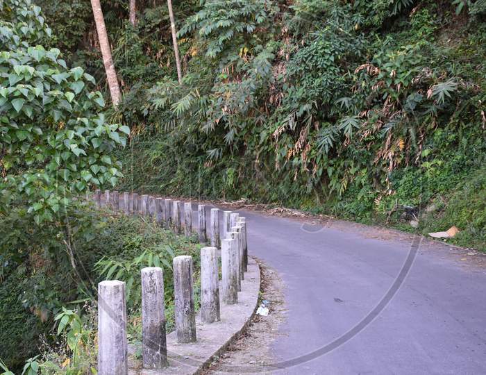 image-of-pitch-road-with-sharp-bend-and-side-protection-stubs-hp986355