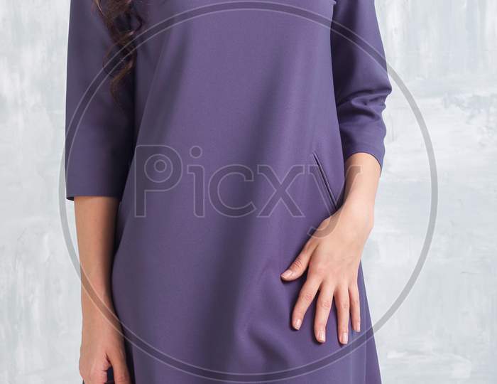 Woman In A Beautiful Purple Short Dress