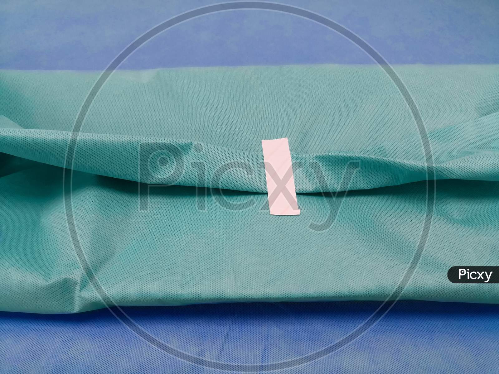 Packing Of Surgical Instruments Set With Green Drape Sheet