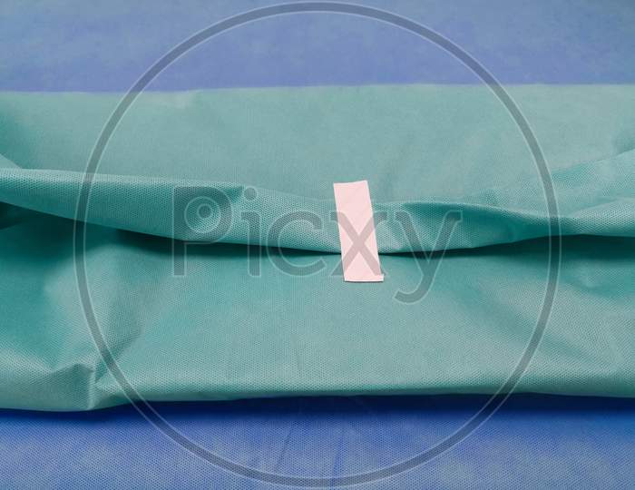 Packing Of Surgical Instruments Set With Green Drape Sheet