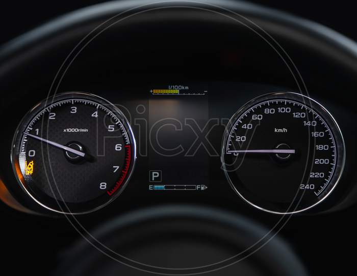 Speedometer, Tachometer And Steering Wheel
Speedometer Of A Modern Car With An Integrated Fuel Gauge In The Tank With White Arrows.
