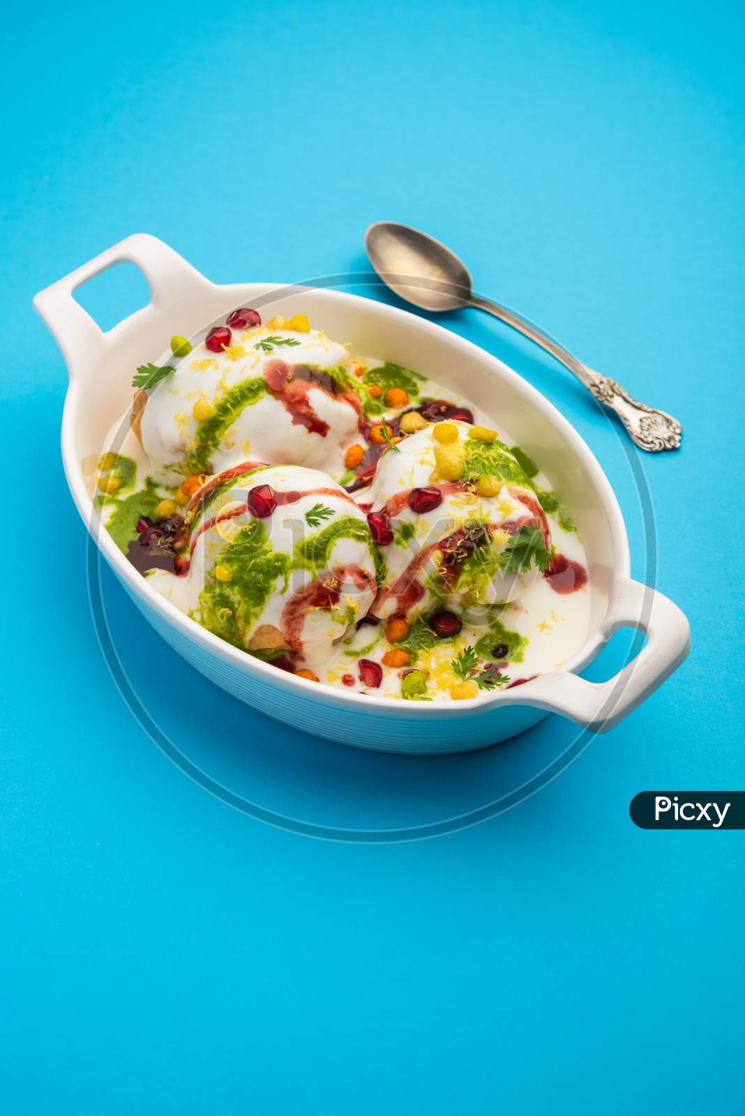 Image Of Dahi Vada Is Indian Snack Food Garnished With Coriander 