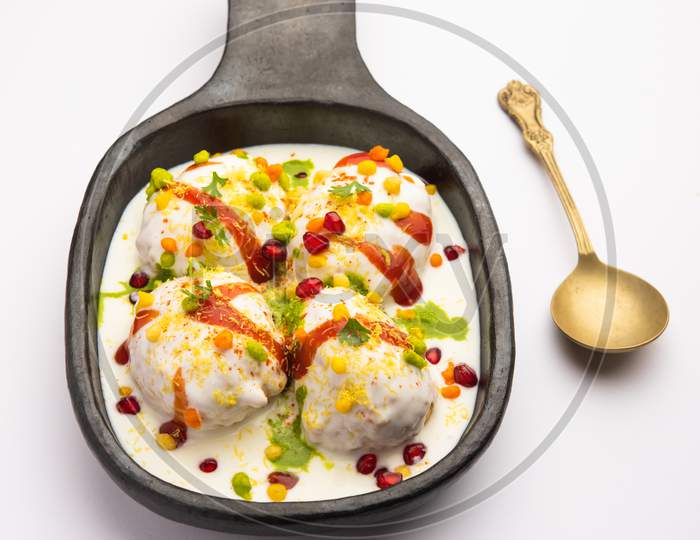 Dahi Vada Is Indian Snack Food. Garnished With Coriander, Boondi, Tamarind And Green Chutney